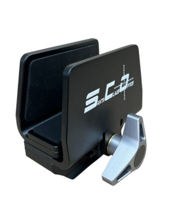 Compact black bike accessory mount with a silver hinge lever and a raised logo on the side, designed to hold a small device